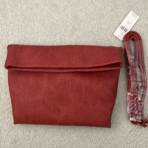 Brand New Anthropologie clutch purse with optional strap.